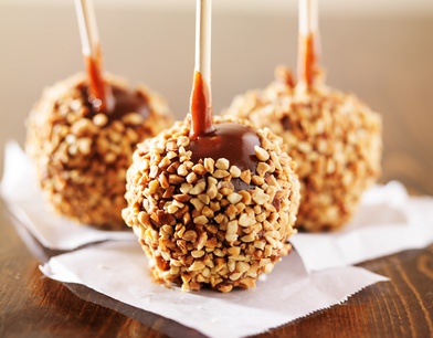 caramel apples close up with nuts