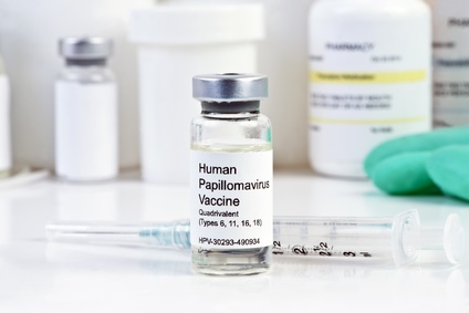 Human Papilloma Virus vaccine with syringe in vial at a clinic.